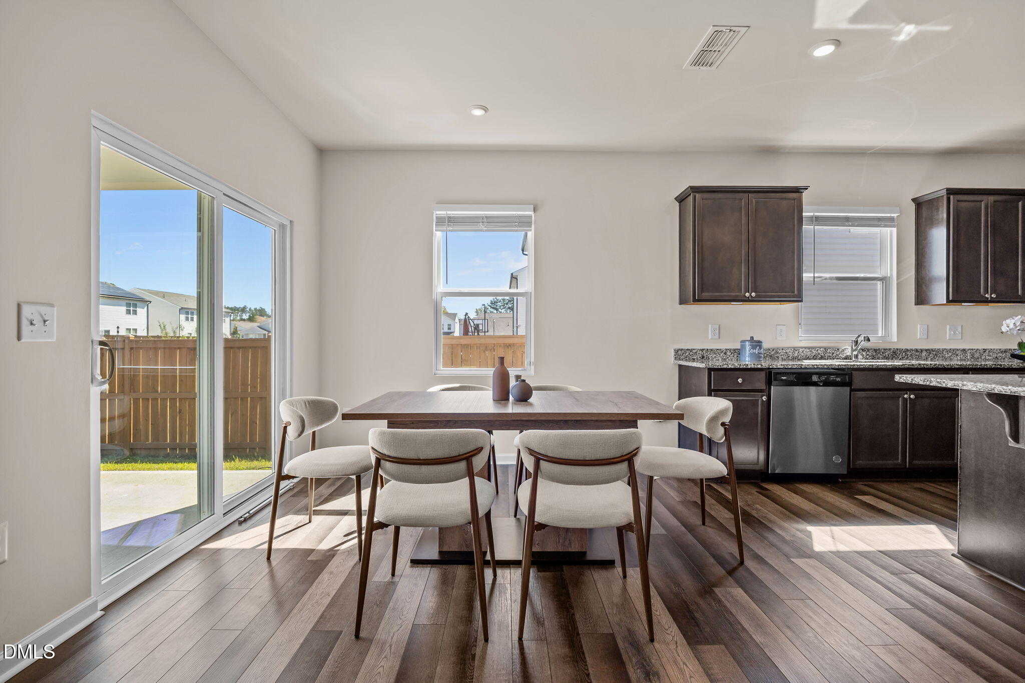 3525 Polygon Place Raleigh, NC 27604 - Photo 6 of 30 a view of a dining room with furniture and wooden floor