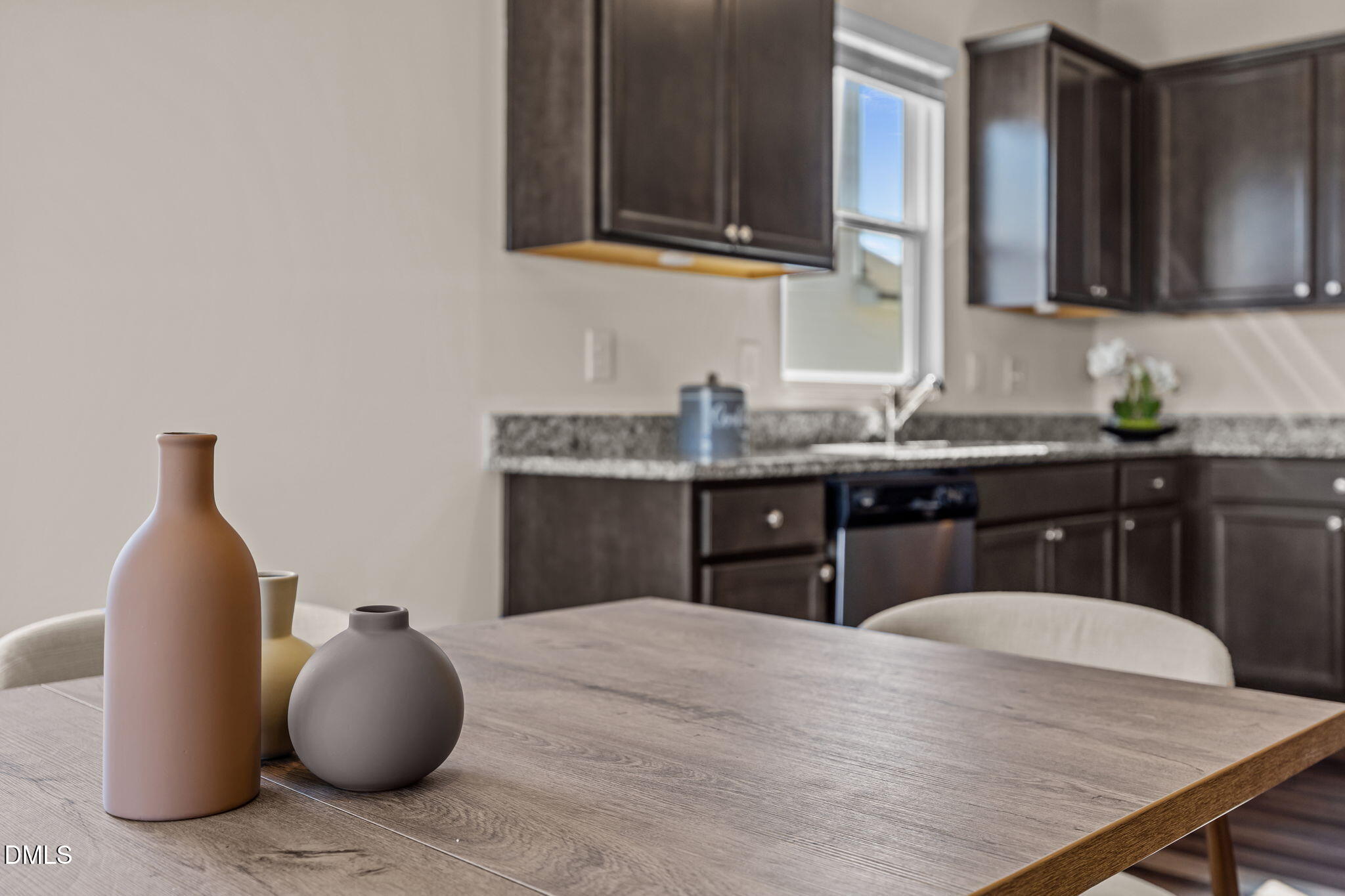 3525 Polygon Place Raleigh, NC 27604 - Photo 8 of 30 a kitchen with stainless steel appliances granite countertop a sink a stove and cabinets