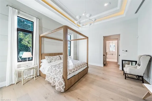 a bed room with a bed and a chair