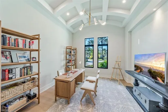 a living room with furniture and a book shelf