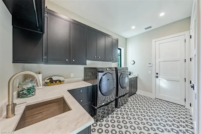 a kitchen with a sink a stove and cabinets
