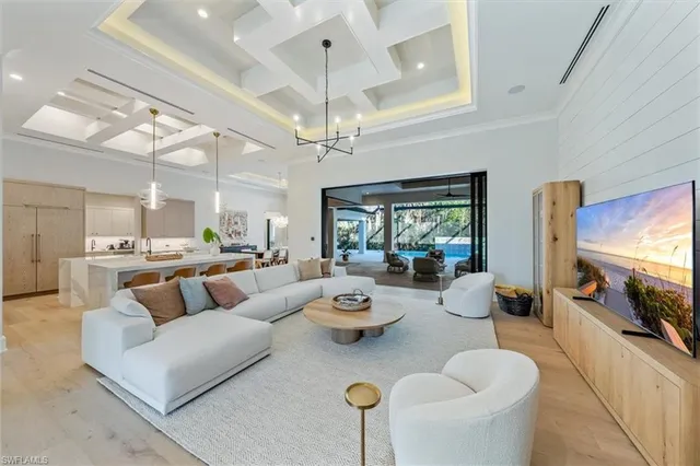 a living room with fireplace furniture and a flat screen tv