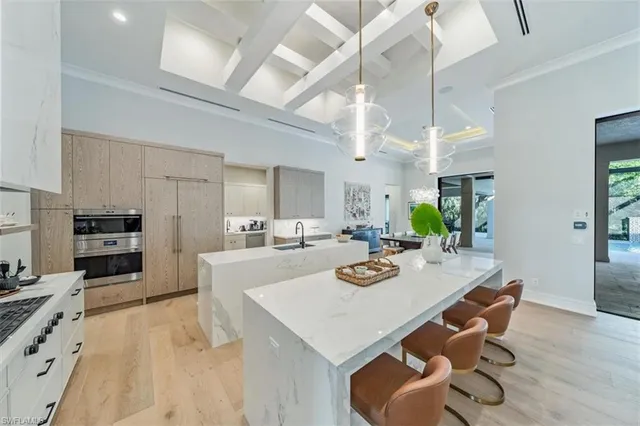 a view of kitchen with cabinets and wooden floor