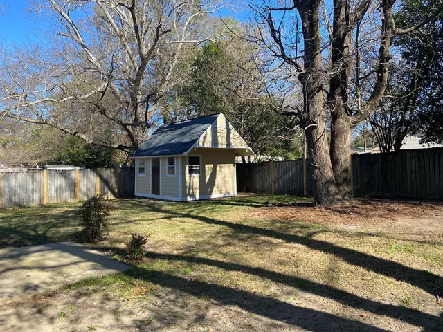 a house with trees in the background