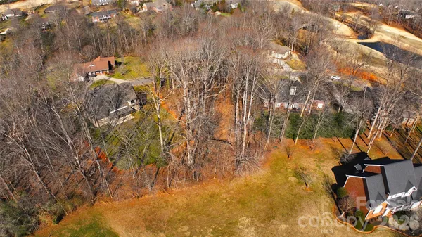 an aerial view of multiple houses with outdoor space