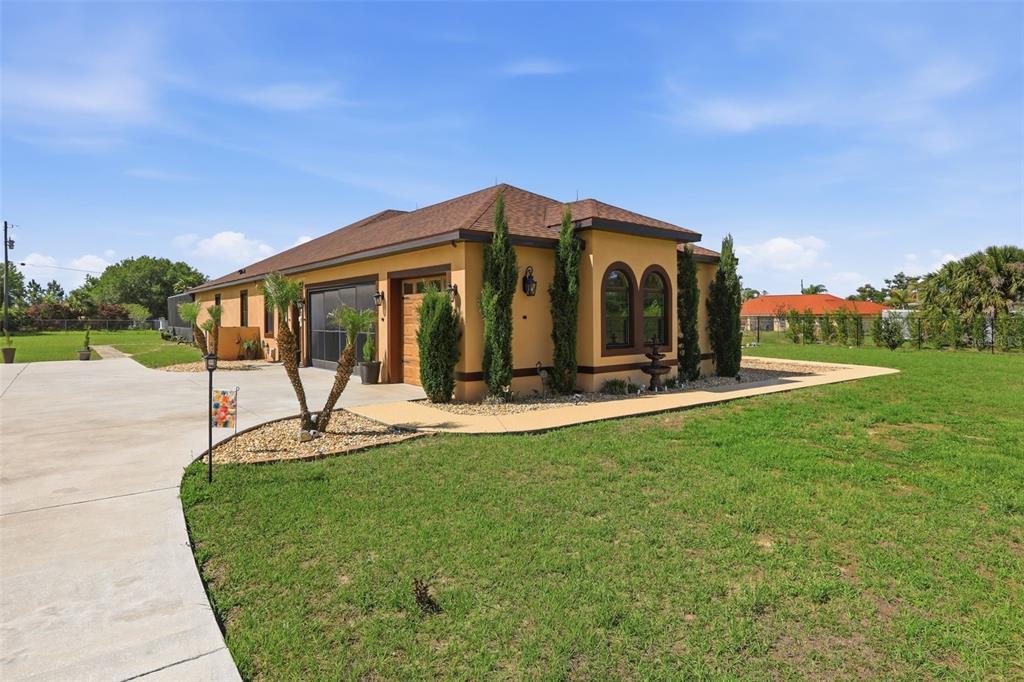 13429 Montevista Road Clermont, FL 34711 - Photo 71 of 89 a front view of a house with a yard