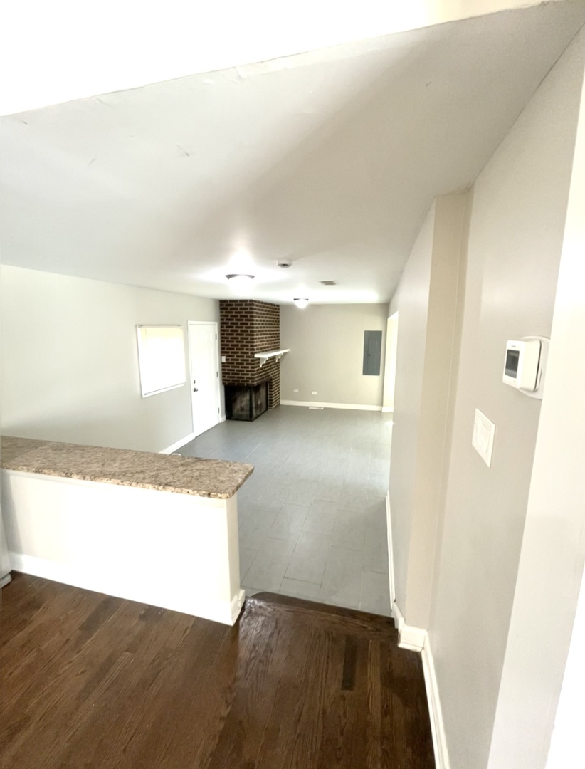 1308 191st Street Homewood, IL 60430 - Photo 5 of 15 a kitchen with granite countertop a refrigerator and a sink