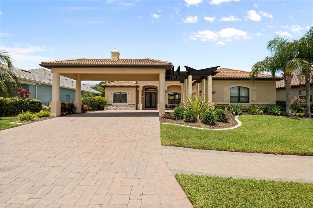 584 Mast Drive Bradenton, FL 34208 - Photo 1 of 1 a front view of a house with a yard and potted plants
