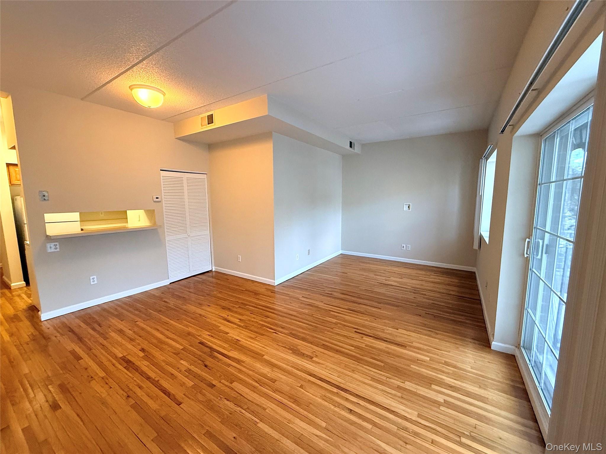 70 Lime Kiln Road, Unit 1A Tuckahoe, NY 10707 - Photo 5 of 10 a view of a bedroom with a sink and a bed
