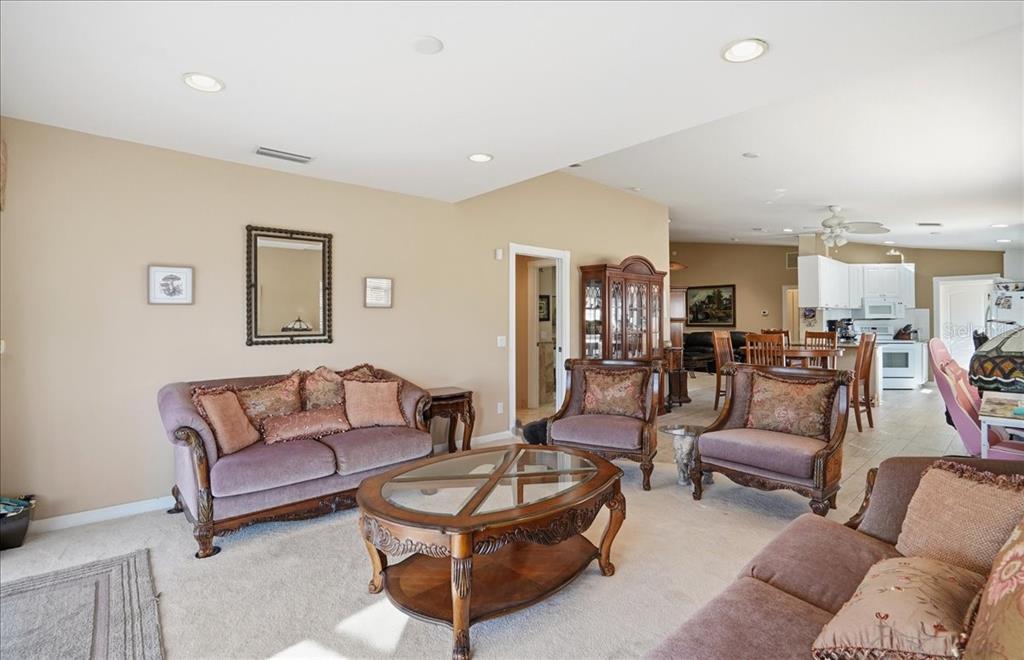 5546 Modena Place Sarasota, FL 34238 - Photo 11 of 67 a living room with furniture kitchen view and a window