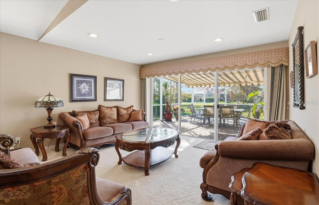 5546 Modena Place Sarasota, FL 34238 - Photo 12 of 67 a living room with furniture and a large window