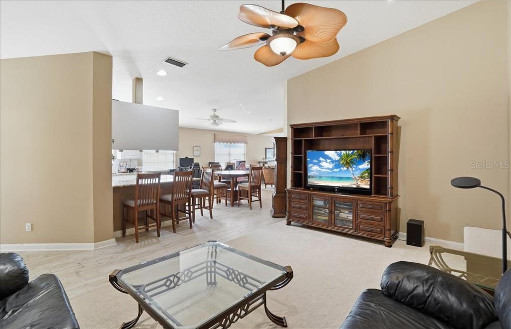 5546 Modena Place Sarasota, FL 34238 - Photo 16 of 67 a living room with furniture and a flat screen tv