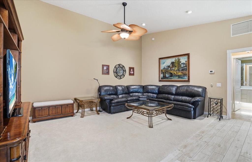 5546 Modena Place Sarasota, FL 34238 - Photo 19 of 67 a living room with furniture and a chandelier