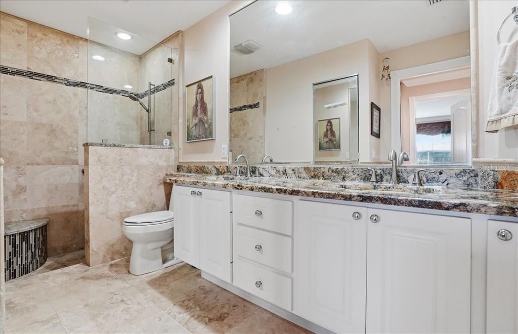5546 Modena Place Sarasota, FL 34238 - Photo 23 of 67 a bathroom with a granite countertop sink toilet and shower