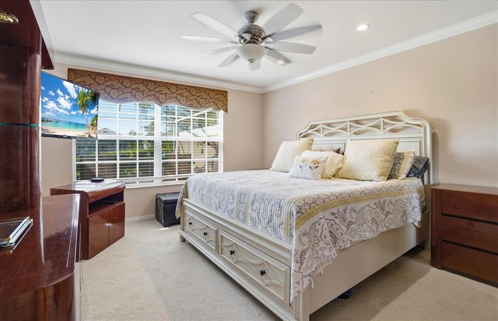 5546 Modena Place Sarasota, FL 34238 - Photo 25 of 67 a bed room with a bed and a large window
