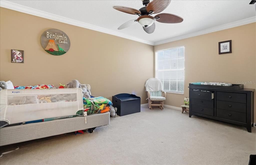 5546 Modena Place Sarasota, FL 34238 - Photo 29 of 67 a bedroom with furniture and a window