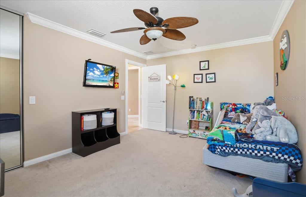 5546 Modena Place Sarasota, FL 34238 - Photo 30 of 67 a living room with furniture and a fireplace