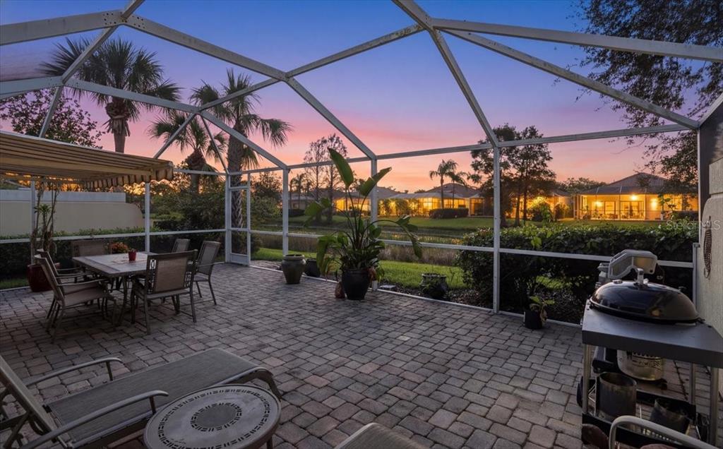5546 Modena Place Sarasota, FL 34238 - Photo 3 of 67 a view of a patio with a table chairs and a fire pit