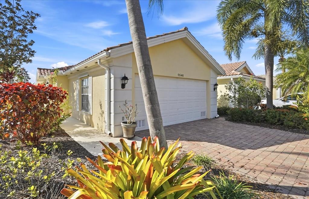 5546 Modena Place Sarasota, FL 34238 - Photo 43 of 67 a front view of a house with a yard