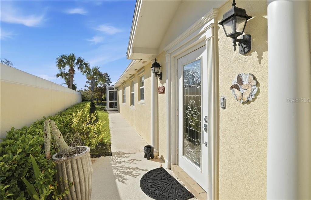 5546 Modena Place Sarasota, FL 34238 - Photo 46 of 67 a bedroom with a bed and a potted plant