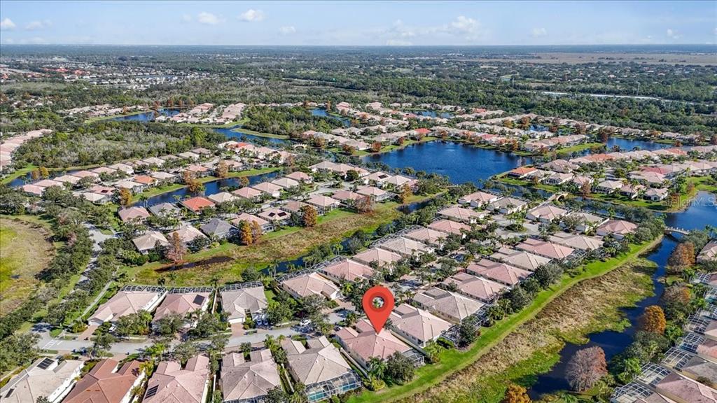 5546 Modena Place Sarasota, FL 34238 - Photo 54 of 67 an aerial view of residential houses with outdoor space