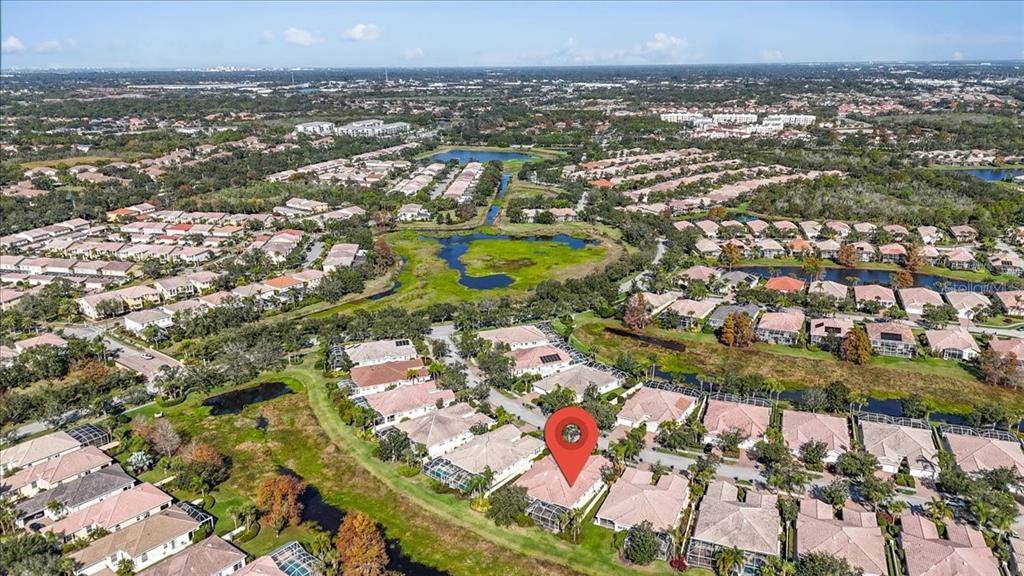 5546 Modena Place Sarasota, FL 34238 - Photo 56 of 67 an aerial view of residential houses with outdoor space