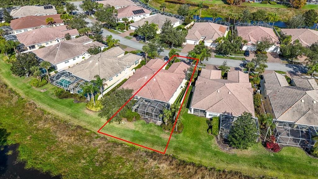 5546 Modena Place Sarasota, FL 34238 - Photo 57 of 67 an aerial view of a houses with yard