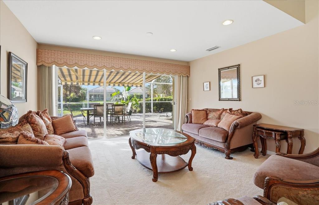 5546 Modena Place Sarasota, FL 34238 - Photo 10 of 67 a living room with furniture and a large window