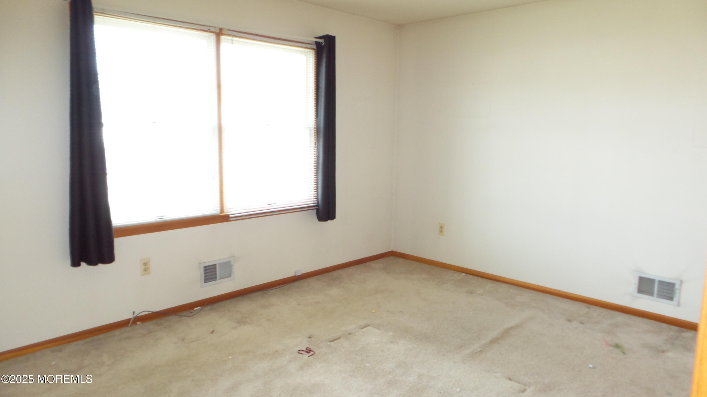 186 Cherry Quay Road Brick, NJ 08723 - Photo 11 of 20 an empty room with a window