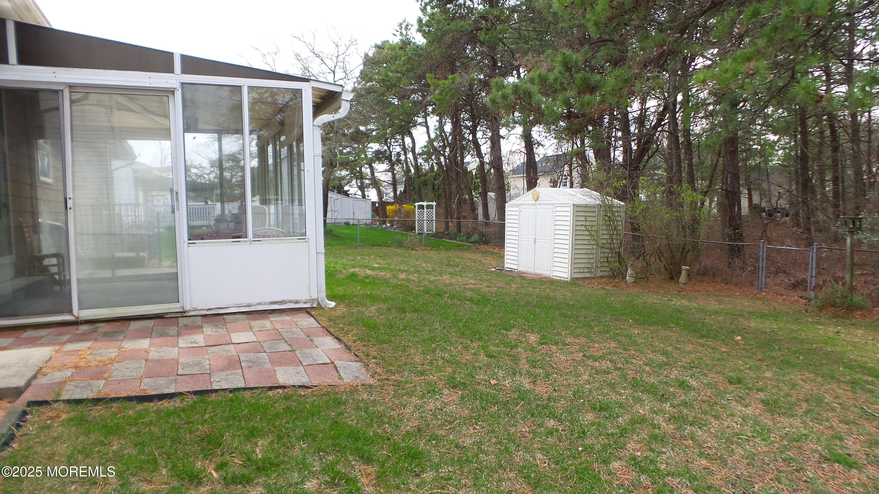 186 Cherry Quay Road Brick, NJ 08723 - Photo 17 of 20 a front view of a house with a garden and tree