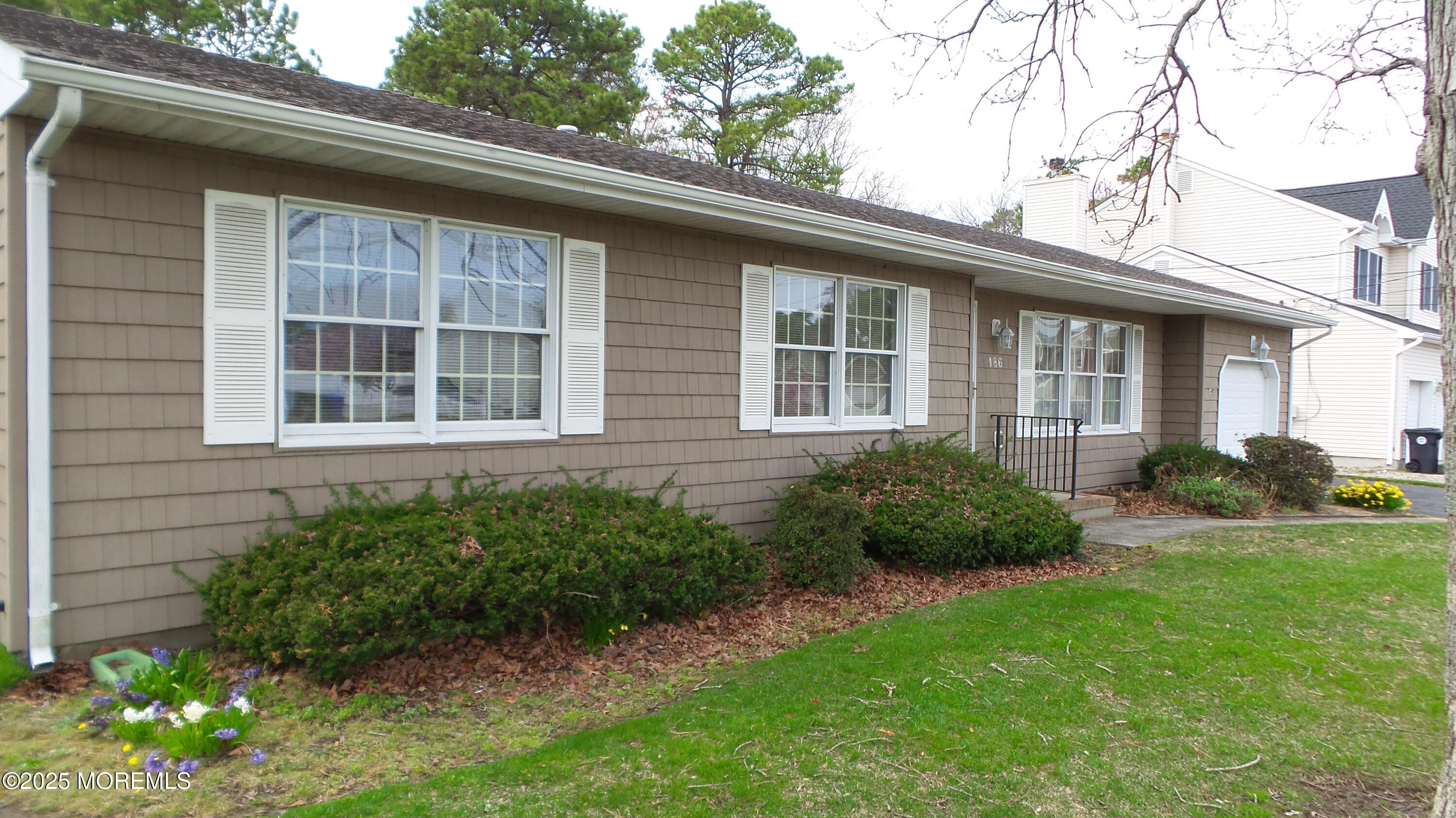 186 Cherry Quay Road Brick, NJ 08723 - Photo 3 of 20 a house view with a garden space