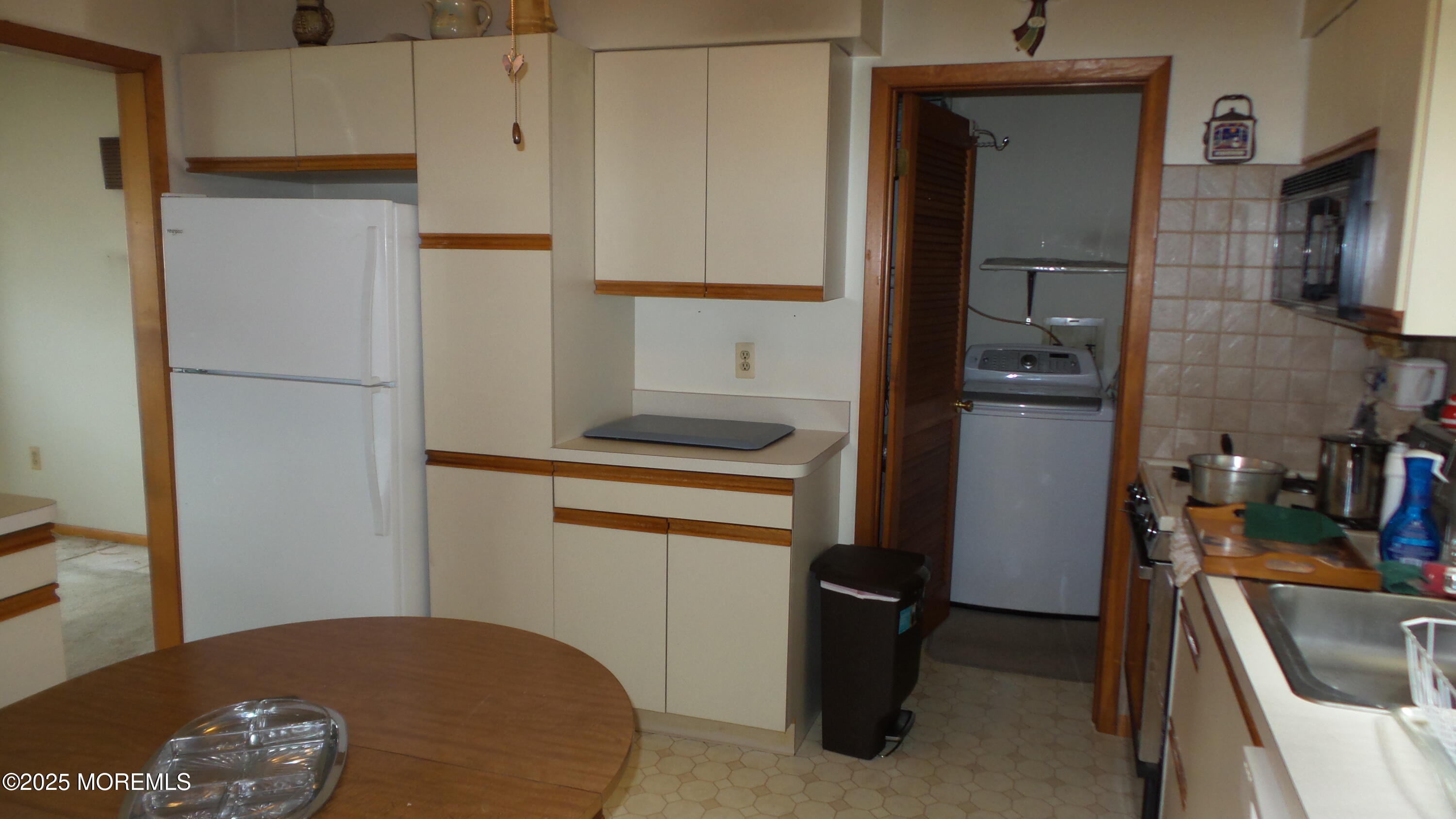 186 Cherry Quay Road Brick, NJ 08723 - Photo 6 of 20 a kitchen with a refrigerator and a sink