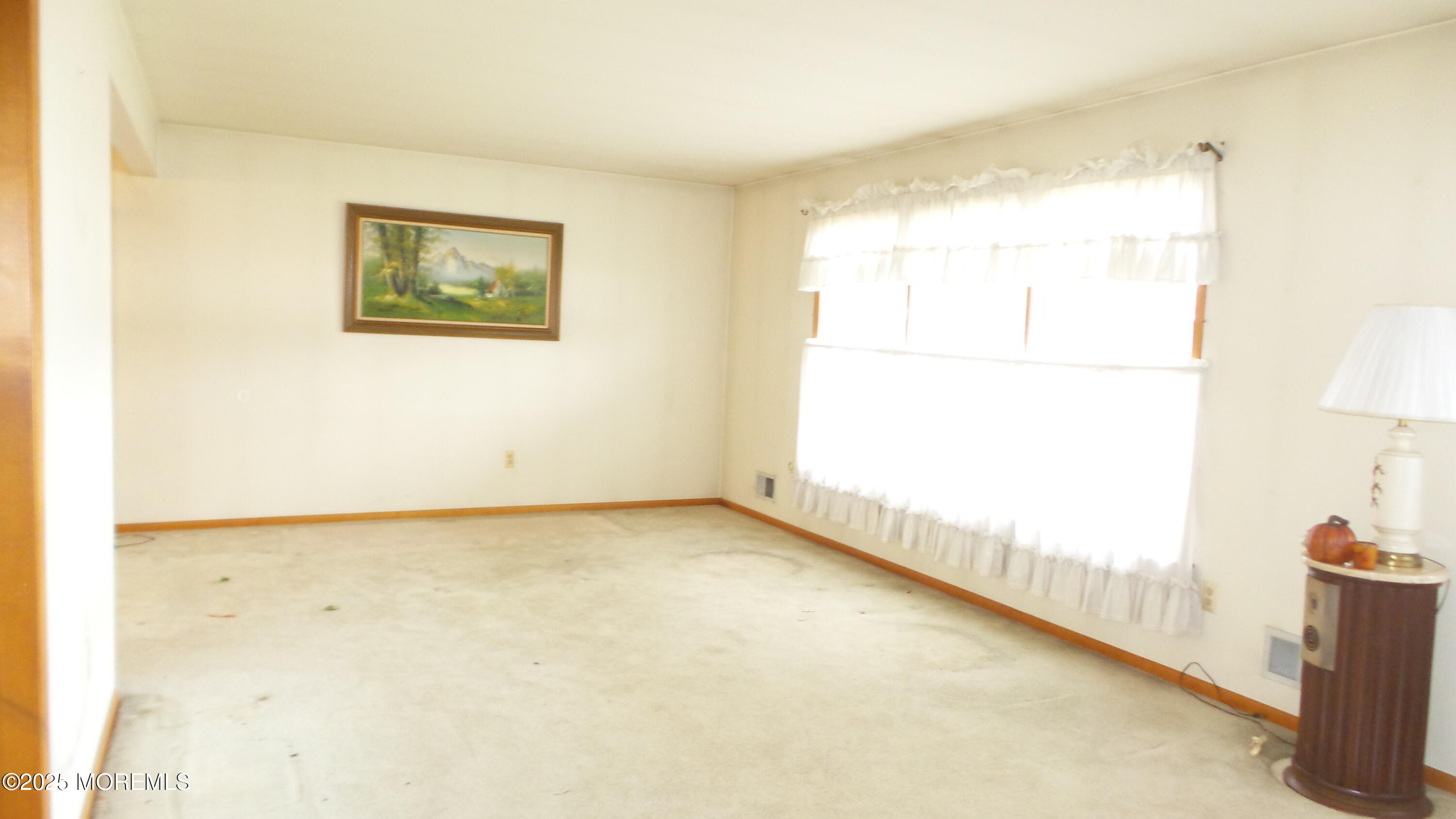 186 Cherry Quay Road Brick, NJ 08723 - Photo 9 of 20 a view of an empty room and a window