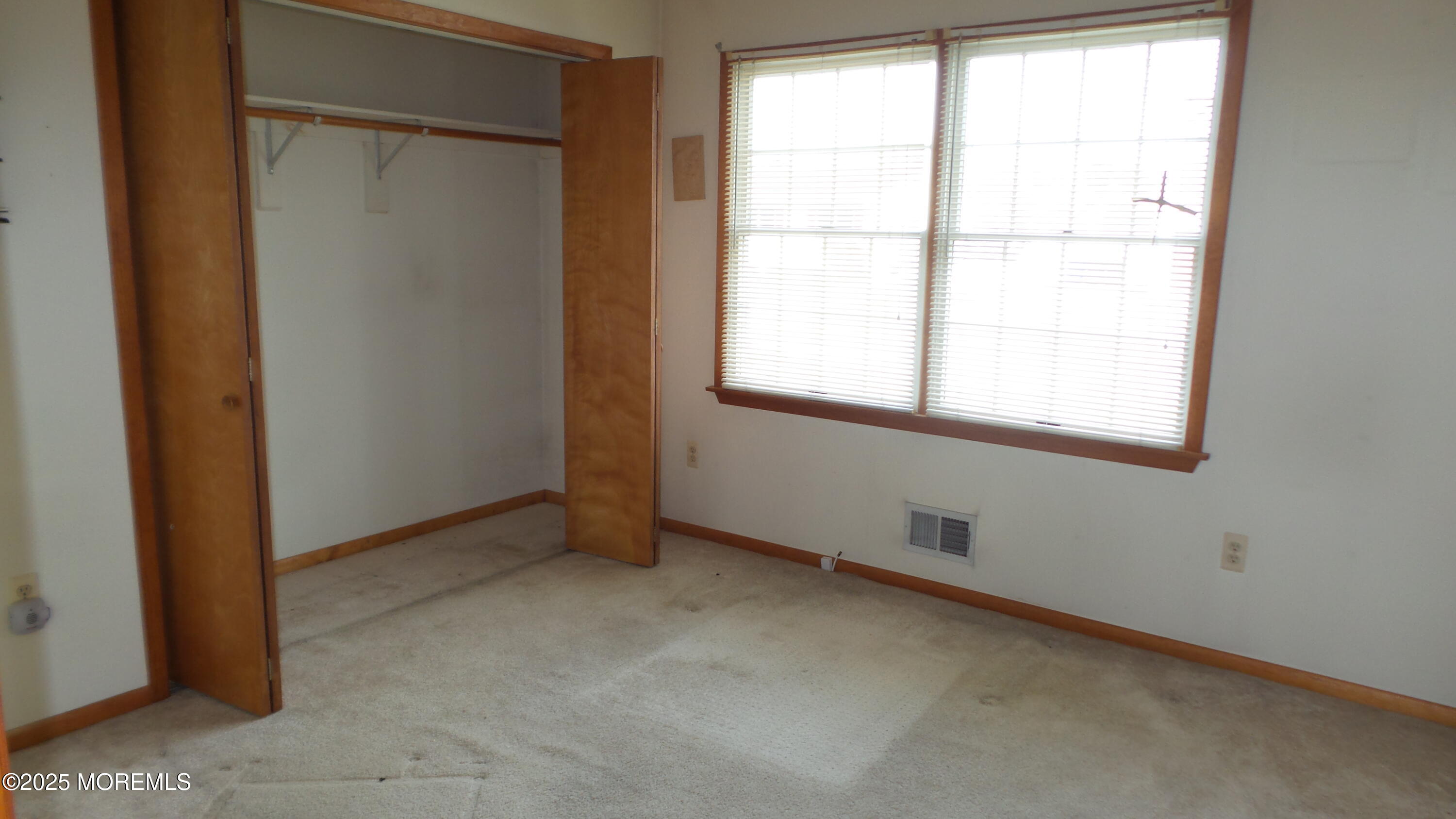 186 Cherry Quay Road Brick, NJ 08723 - Photo 10 of 20 an empty room with a window