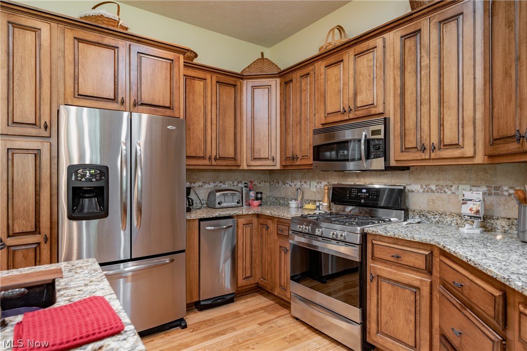 3908 River Road Vienna, WV 26105 - Photo 14 of 48 The Gormet Kitchen features maple cabinets, Stainless Steel appliances, under cabinet lighting and Granite countertops.