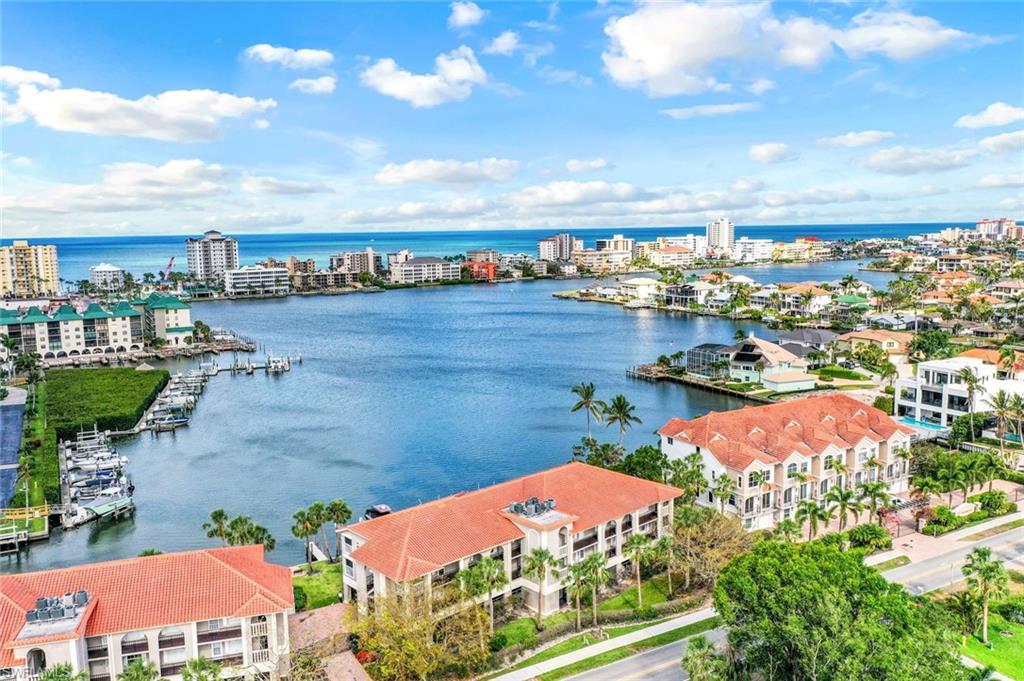 9103 Vanderbilt Drive, Unit 208 Naples, FL 34108 - Photo 20 of 23 an aerial view of a city