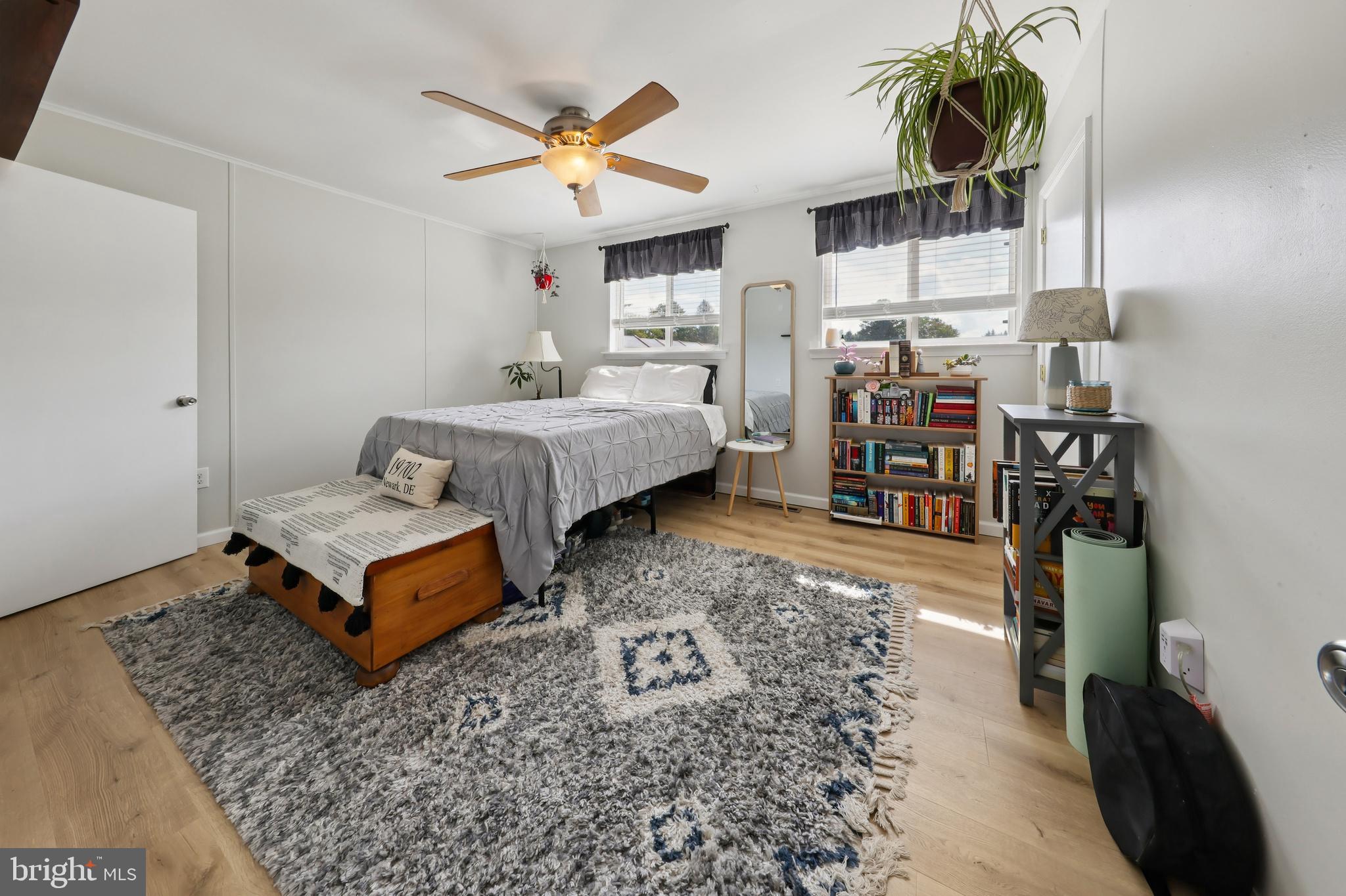 852 Hasting Court Newark, DE 19702 - Photo 13 of 29 a spacious bedroom with a bed and a chandelier