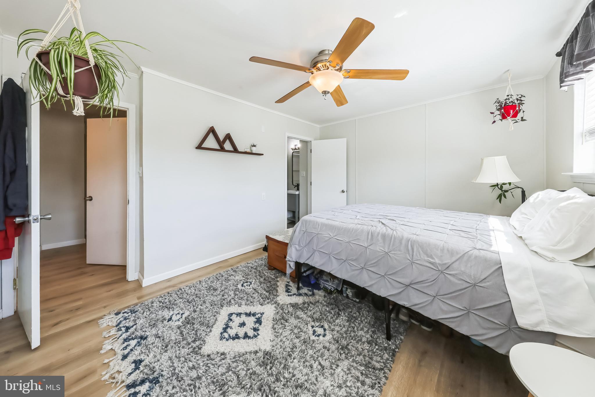 852 Hasting Court Newark, DE 19702 - Photo 15 of 29 a bedroom with a bed and a chandelier