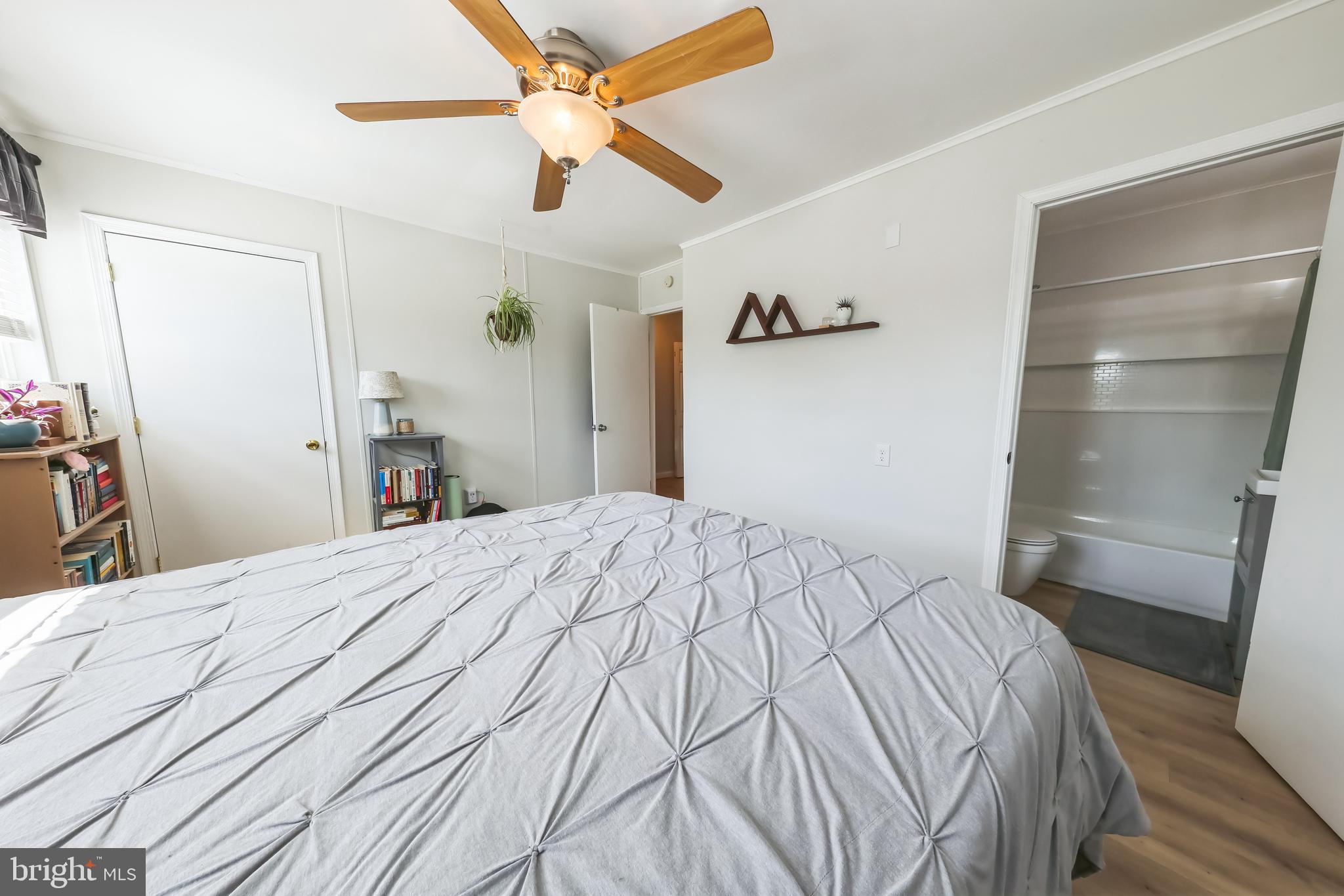852 Hasting Court Newark, DE 19702 - Photo 16 of 29 a bedroom with a bed and a chandelier