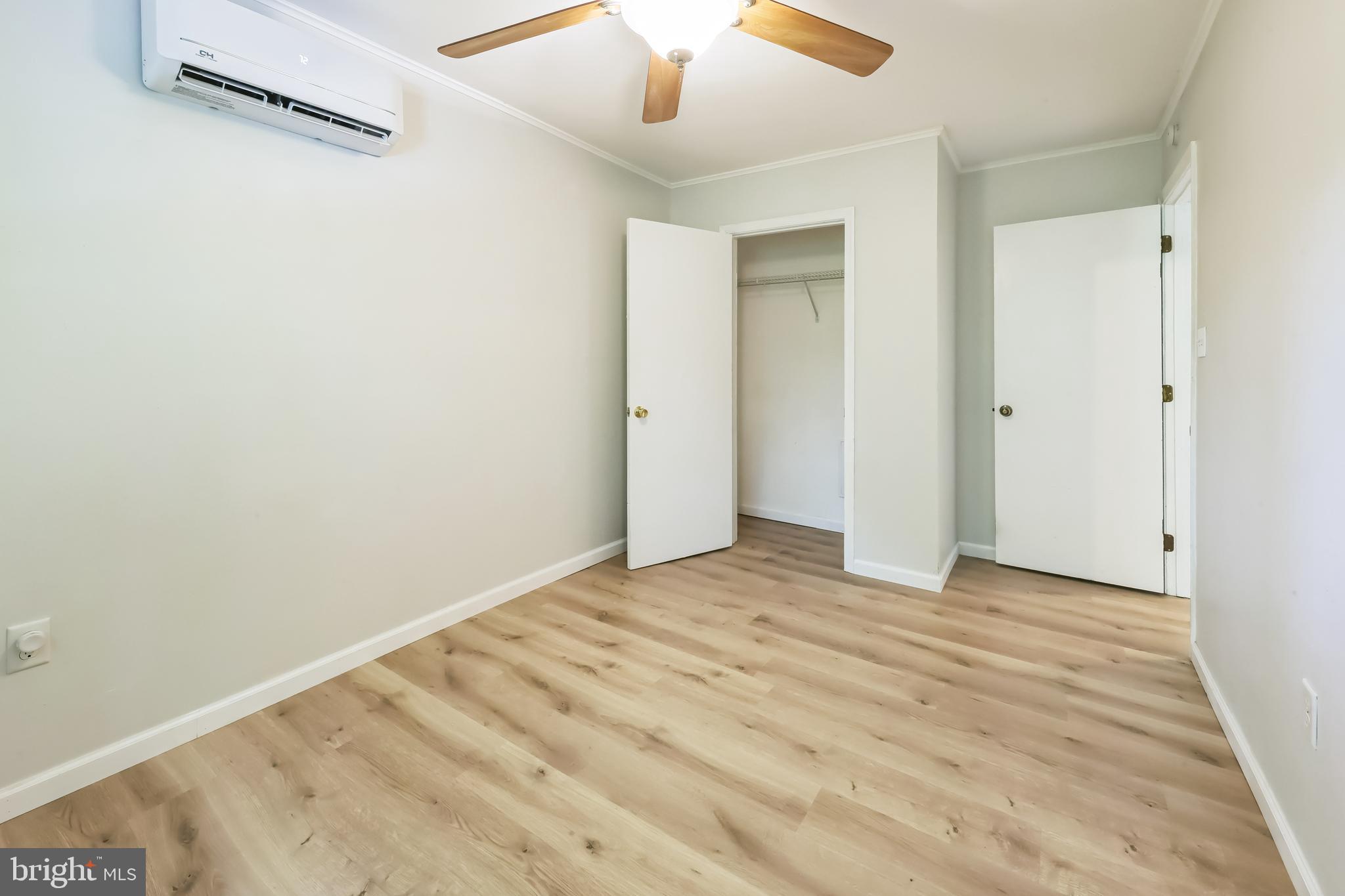852 Hasting Court Newark, DE 19702 - Photo 24 of 29 a view of an empty room with wooden floor