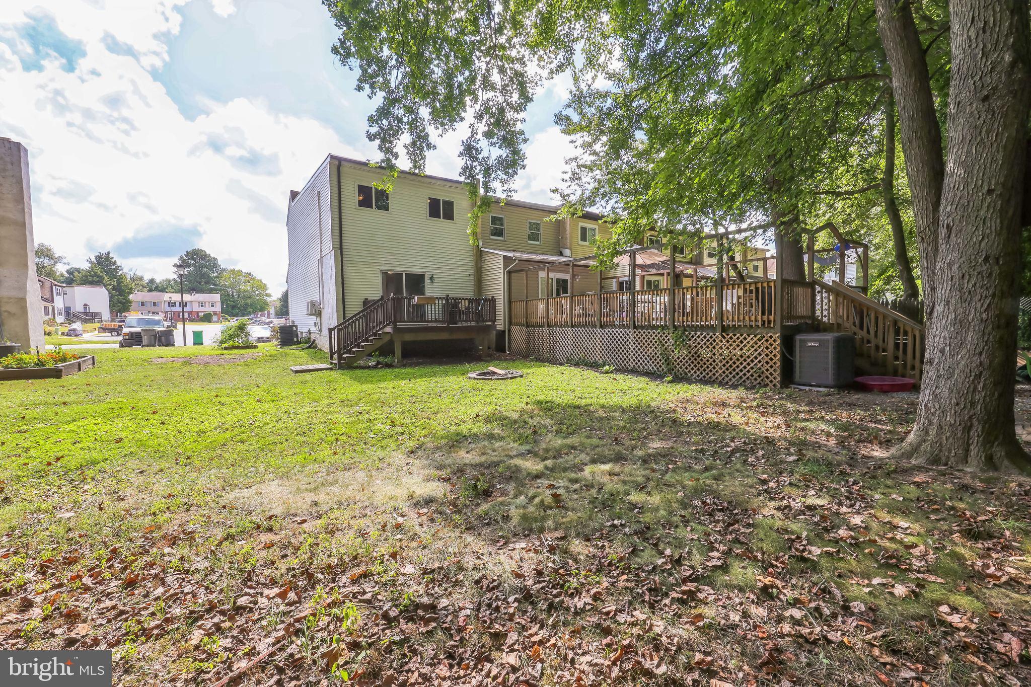 852 Hasting Court Newark, DE 19702 - Photo 29 of 29 a view of a garden with a building in the background