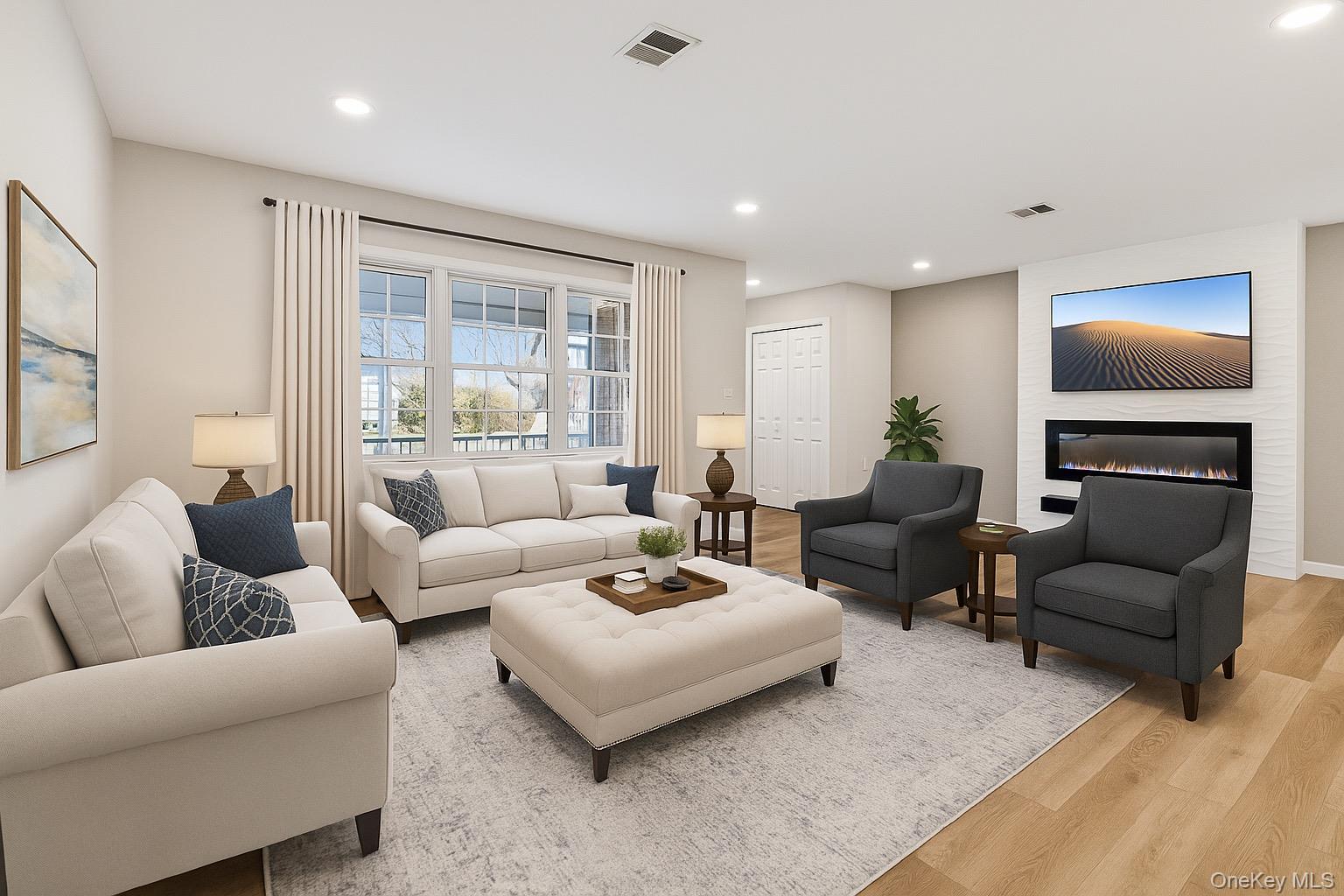 195 Canterbury Drive Ridge, NY 11961 - Photo 4 of 26 a living room with furniture and a flat screen tv
