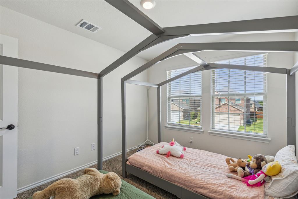 3012 Glazner Drive Forney, TX 75126 - Photo 18 of 25 a bedroom with bed and a window