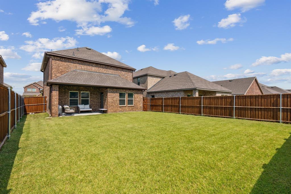 3012 Glazner Drive Forney, TX 75126 - Photo 25 of 25 a view of a house with backyard and porch