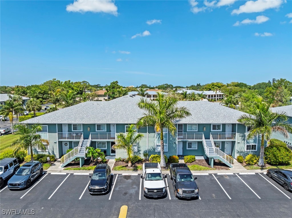 a view of a house with swimming pool and sitting area