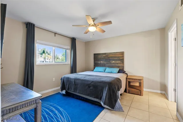 a bedroom with a bed and a desk