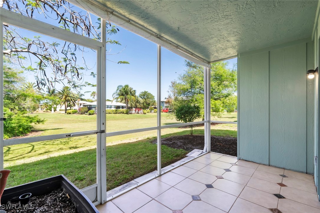138 Cypress Way East, Unit 404 Naples, FL 34110 - Photo 2 of 32 a view of a room with a large window