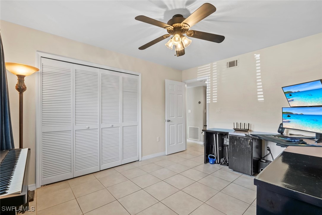 138 Cypress Way East, Unit 404 Naples, FL 34110 - Photo 25 of 32 a view of a workspace with furniture