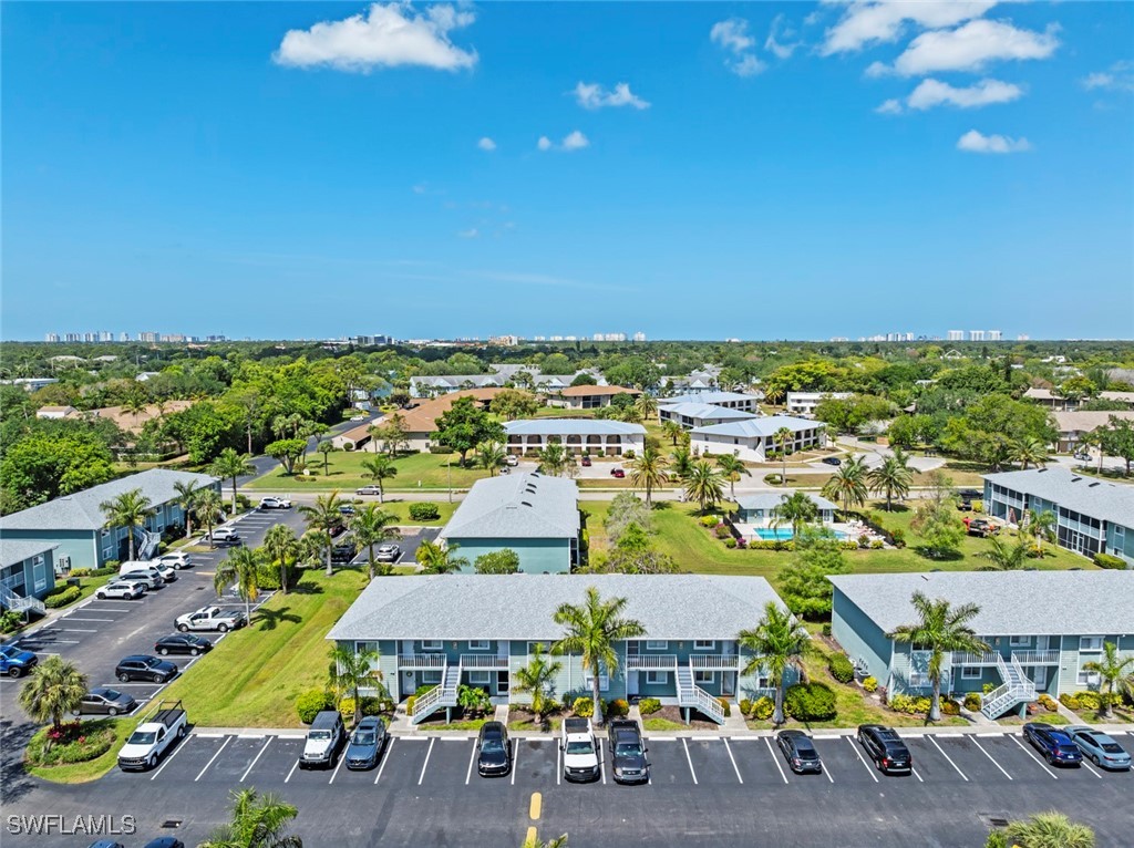 138 Cypress Way East, Unit 404 Naples, FL 34110 - Photo 28 of 32 an aerial view of multiple house
