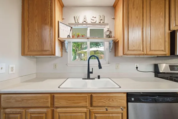 a kitchen with a sink and cabinets